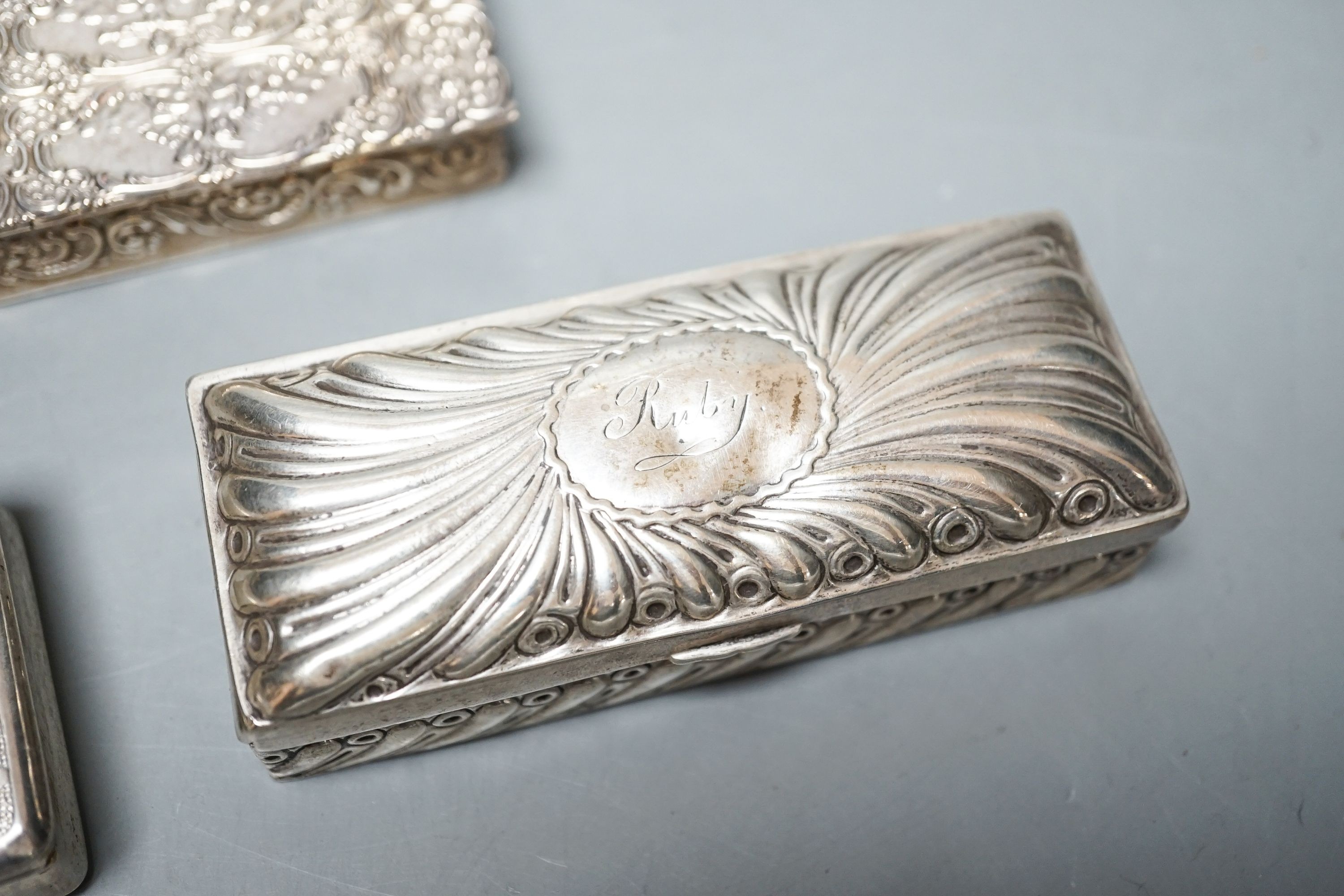 A late Victorian silver ring box, London, 1895(a.f.), 97mm, a later silver snuff box and two white metakl boxes.
